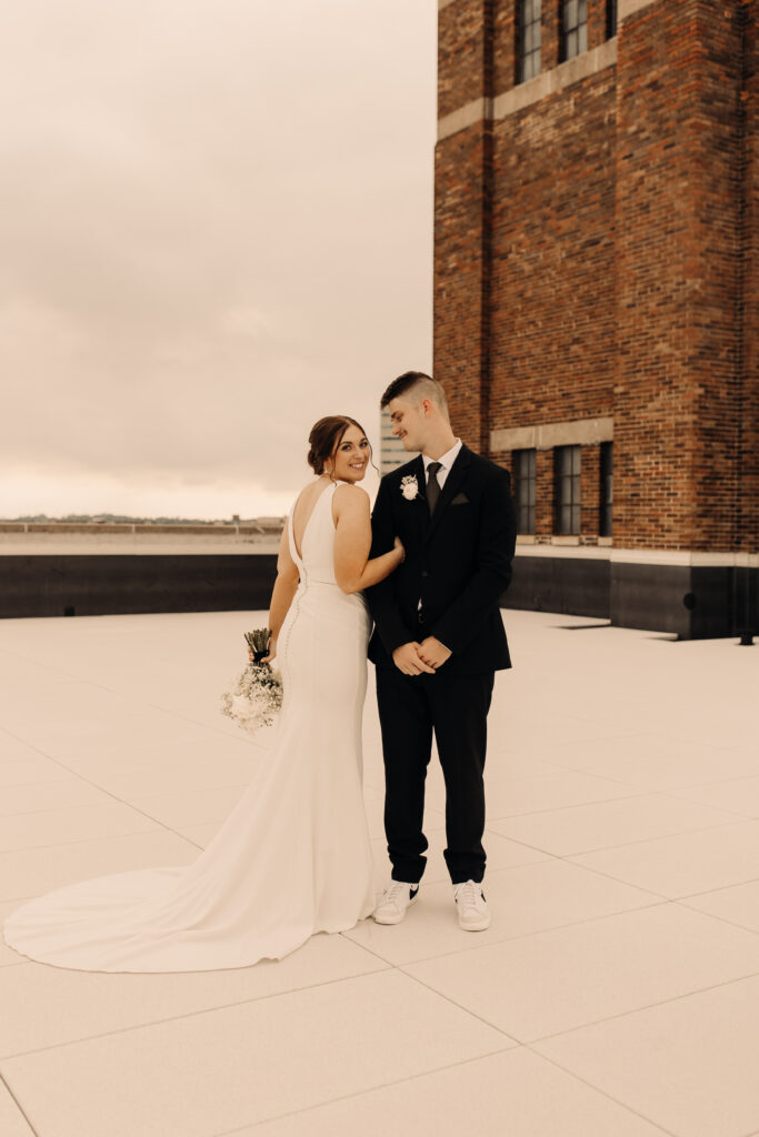 Bride and groom on a rooftop in iowa