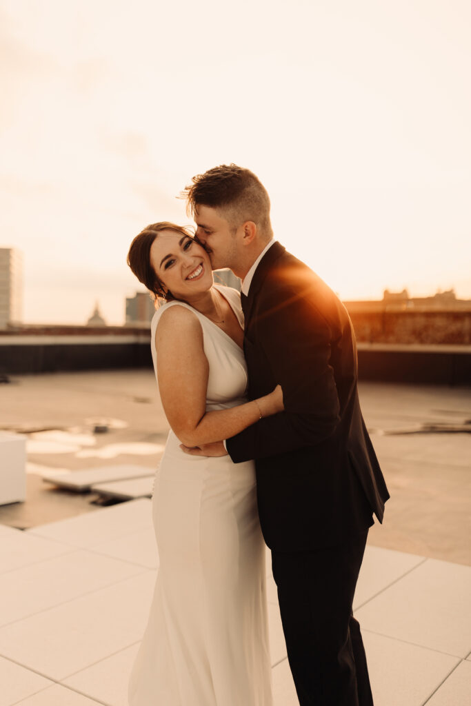 golden hour bride and groom on a rooftop in iowa