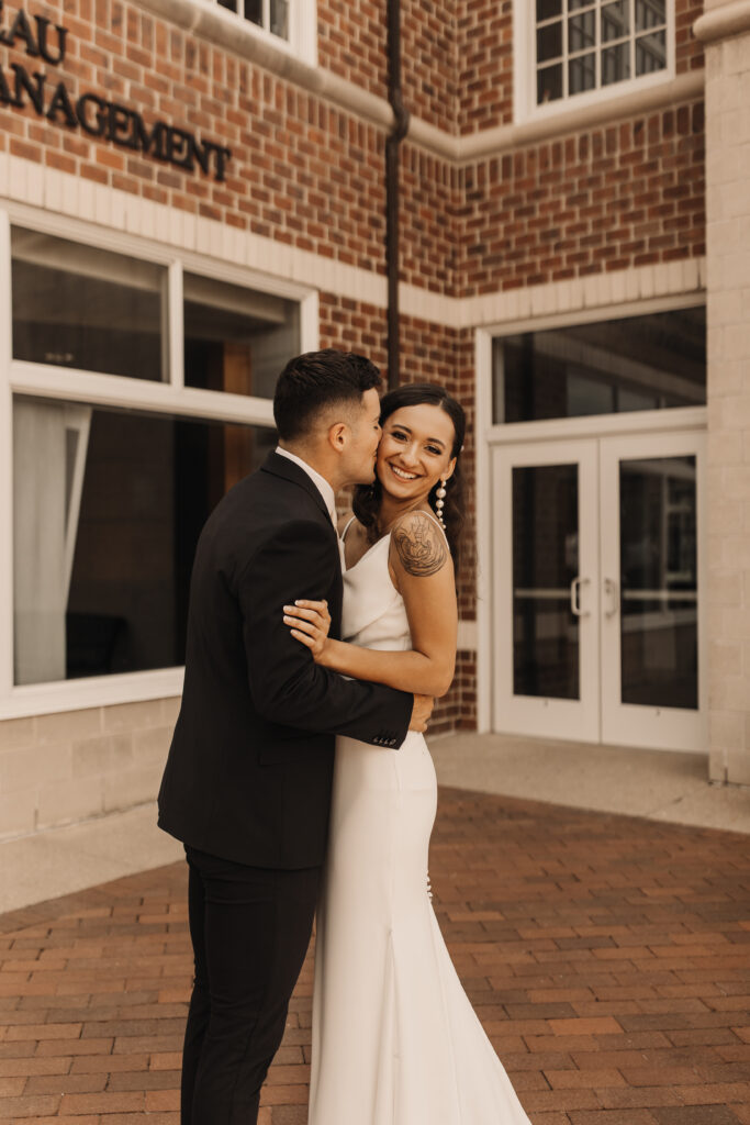bride and groom portraits with brick architecture 